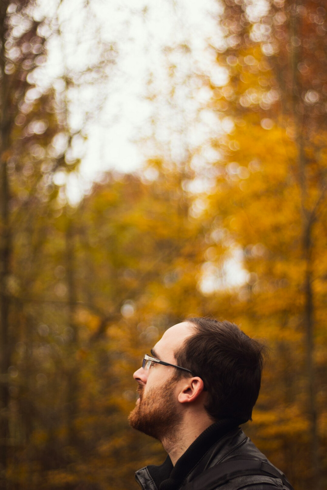 Portrait of a Czech male sociologist in his 40s wearing glasses