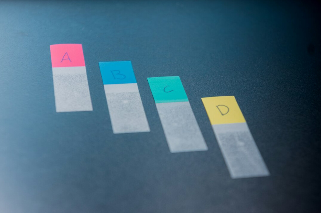 Close-up of colorful statistical charts and graphs on paper and screen